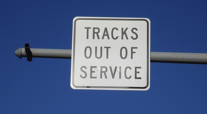 Tracks Out Of Service sign over abandoned spur leading into the Davis-Monthan Air Force Base, Tucson, Arizona